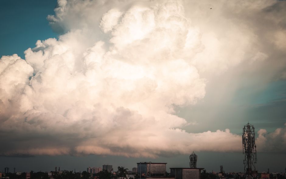A collage showing diverse weather in India, from sunny beaches to misty mountains and monsoon rains