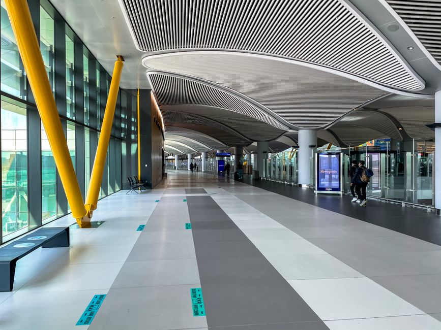 Busy terminal at Dublin Airport, Ireland with passengers and planes