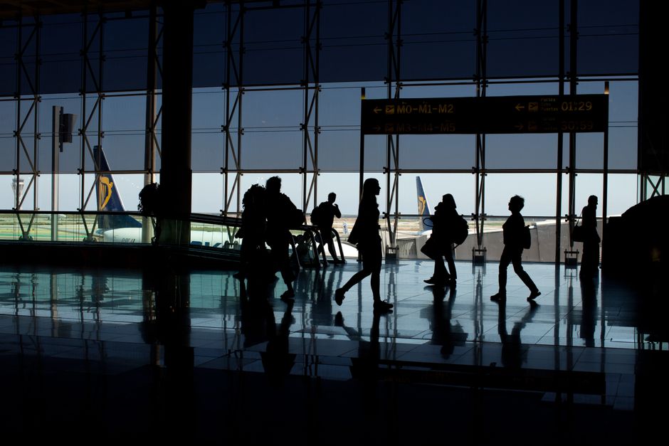 Modern Dublin airport terminal in Ireland with planes visible through large windows