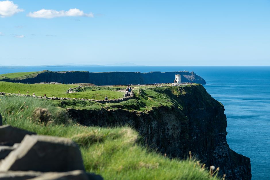 Dramatic Cliffs of Moher coastline with waves crashing in County Clare, Ireland
