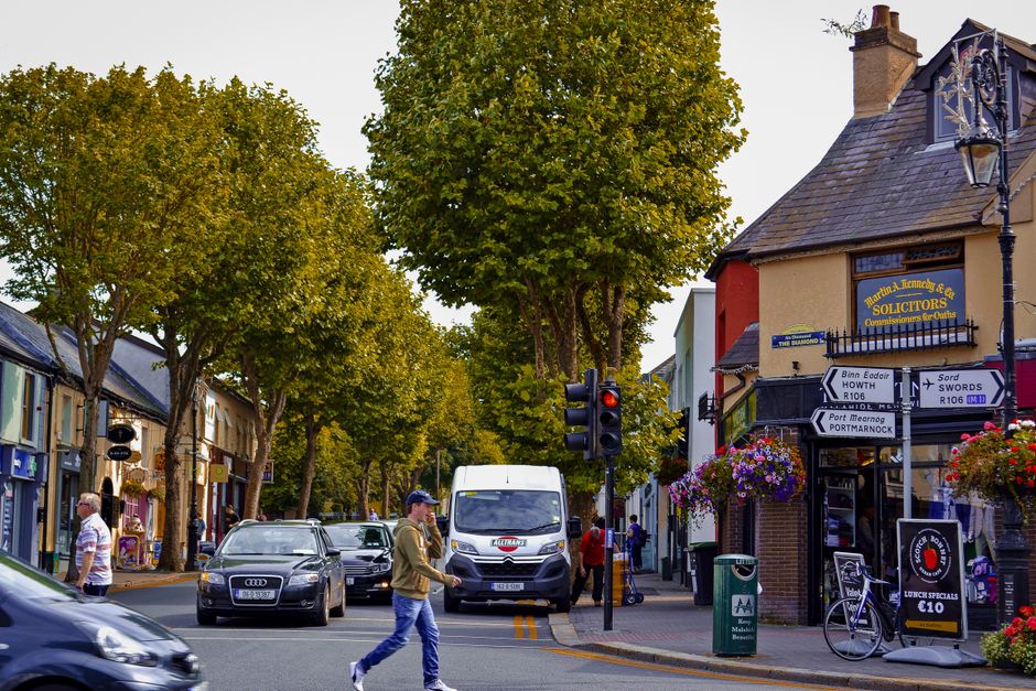 People shopping on Grafton Street, Dublin, Ireland with historic buildings