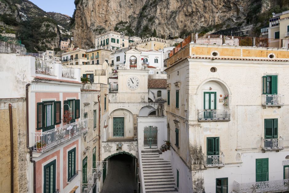Charming hotel balcony overlooking a picturesque Italian street scene