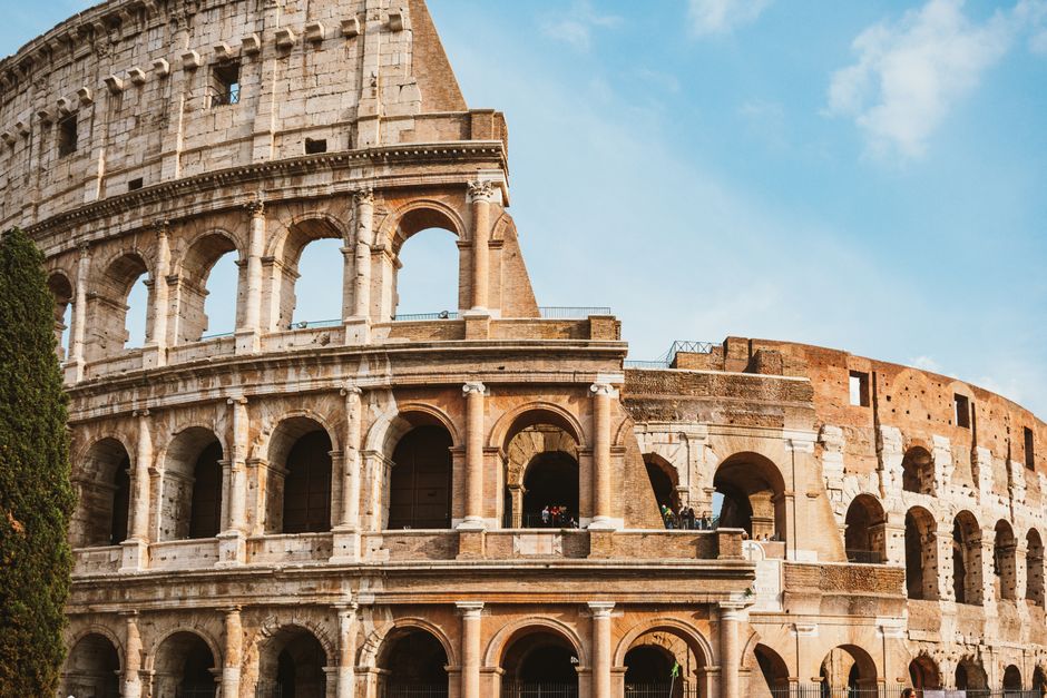 The iconic Colosseum in Rome, Italy, under a clear blue sky, a symbol of ancient Roman history