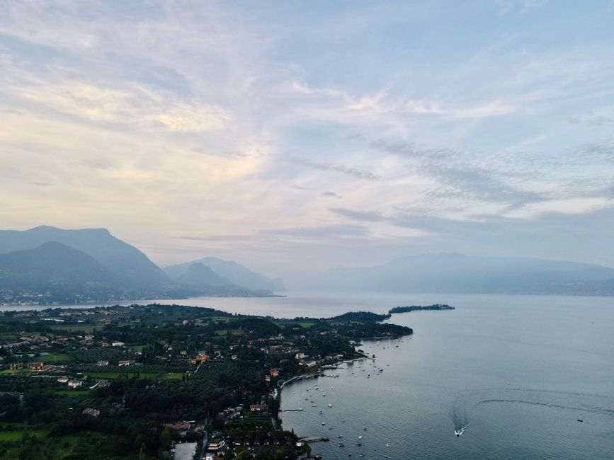 High-speed Frecciarossa train speeding through a picturesque Italian countryside