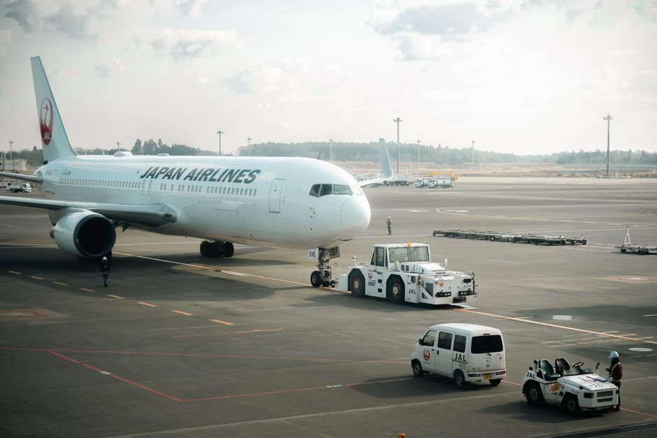 Modern terminal building at Narita International Airport in Japan with planes