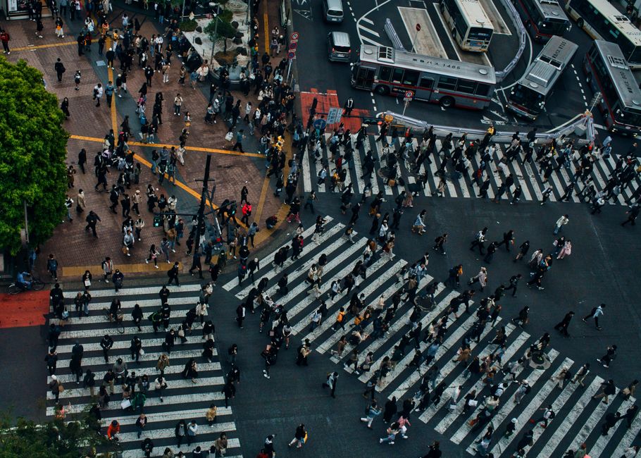 Iconic Shibuya crossing in Tokyo, Japan, bustling with pedestrians and vibrant city lights