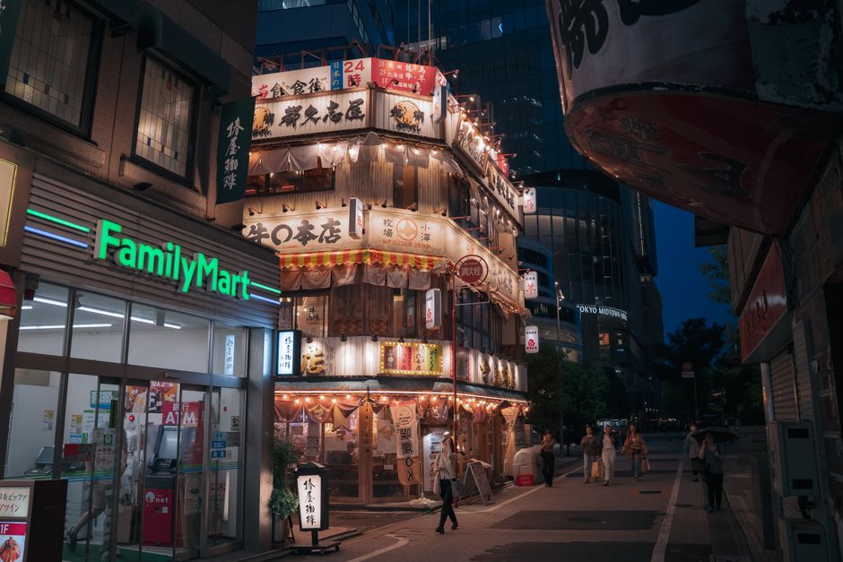 Vibrant shopping street in Tokyo, Japan, with neon signs and people
