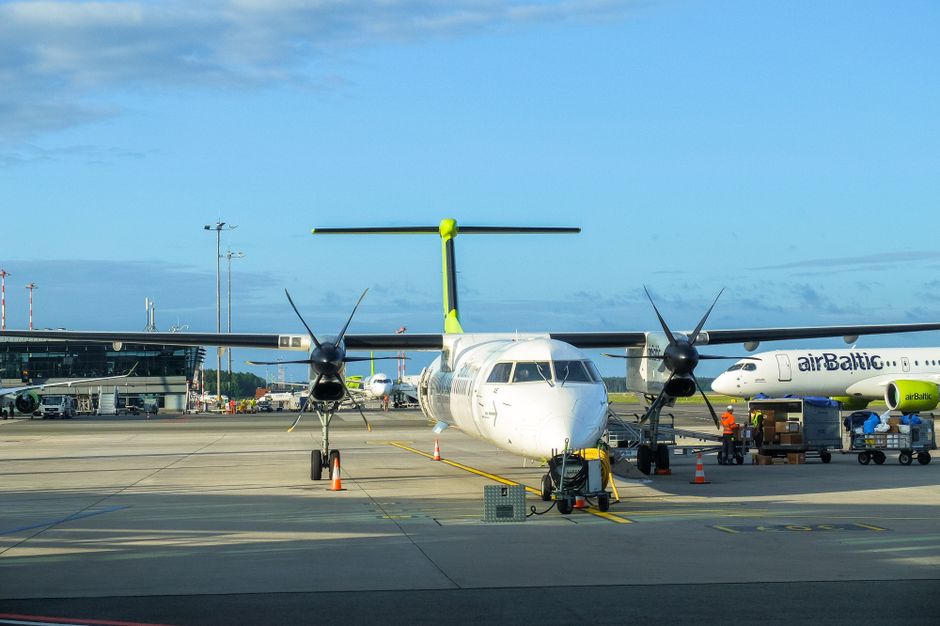 Modern terminal building of Riga International Airport in Latvia with airplanes on the tarmac