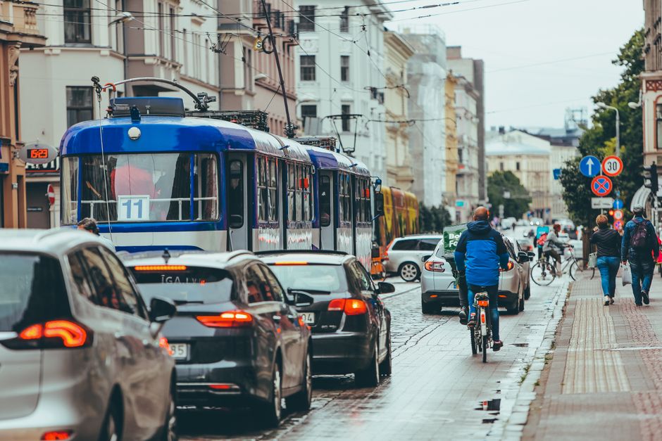 A modern tram moving through the streets of Riga, Latvia
