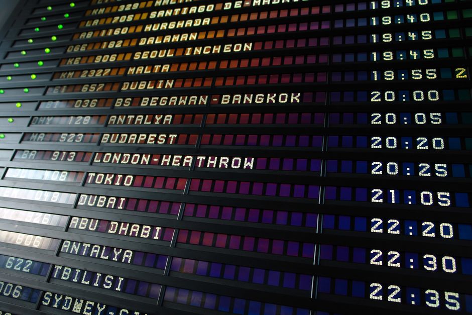 Departure board showing flight delays at Vilnius Airport, Lithuania