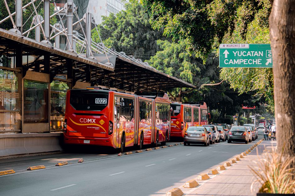 Mexico City Metro train arriving at a station platform with passengers