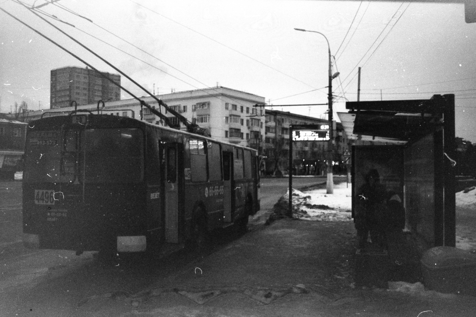 A vibrant trolleybus on a bustling street in Chisinau, Moldova