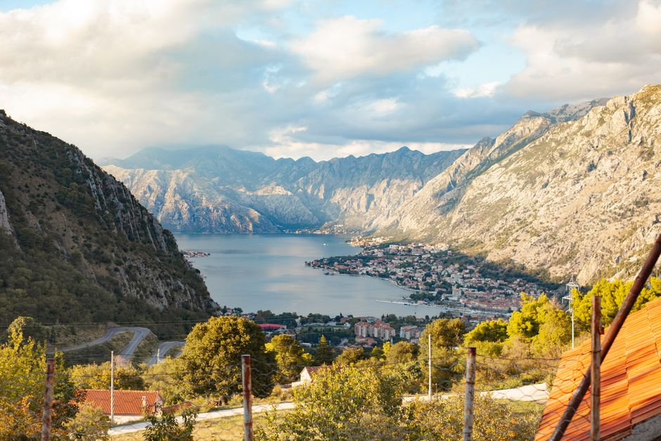 Stunning coastal view of Montenegro with mountains meeting the Adriatic Sea, symbolizing a protected journey
