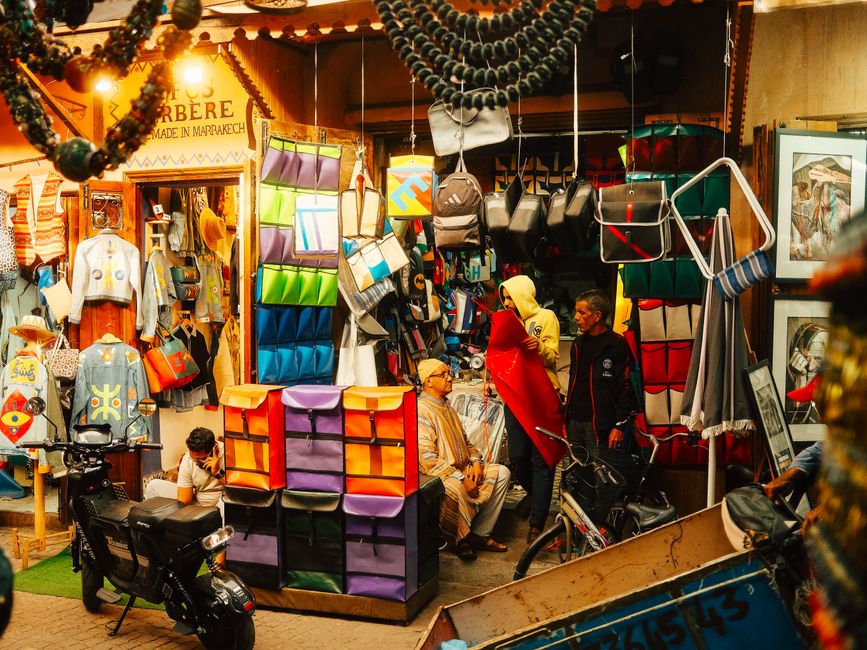 A bustling Moroccan souk with colorful spices and traditional goods, illustrating the cost of living in Morocco