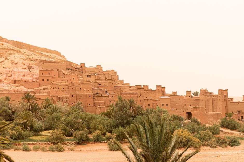Ancient fortified village of Aït Benhaddou in Morocco at sunset, a popular day trip destination