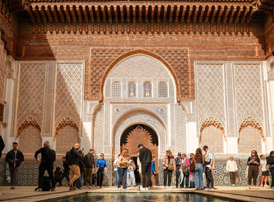 Traveler using a map to navigate the vibrant streets of Marrakech, Morocco