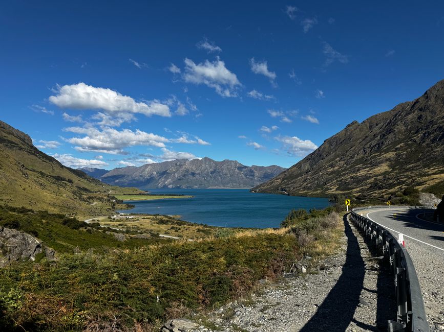 Stunning New Zealand landscape with mountains and clear water, welcoming travelers