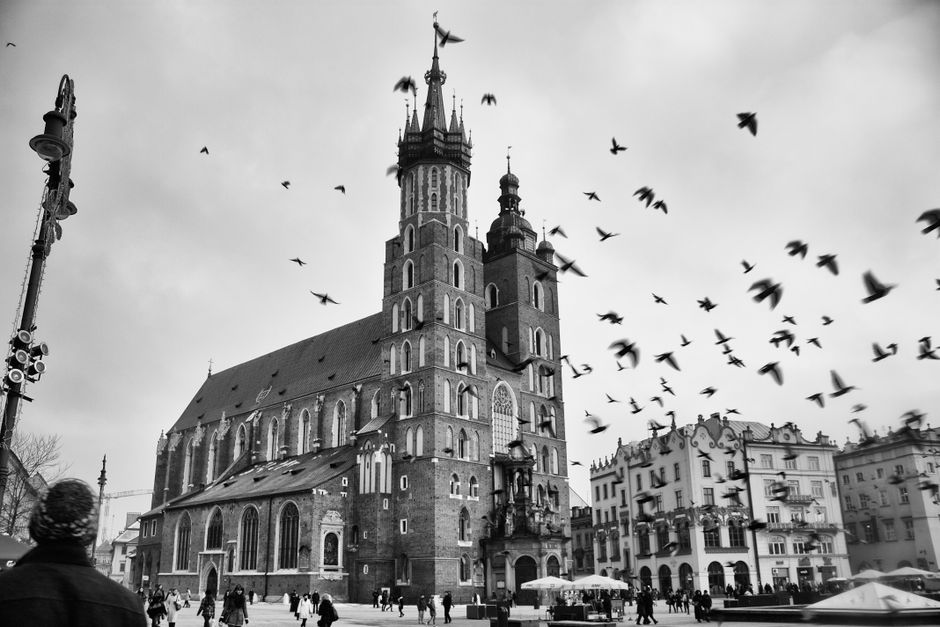 Vibrant market square in Krakow, Poland, bustling with tourists and locals