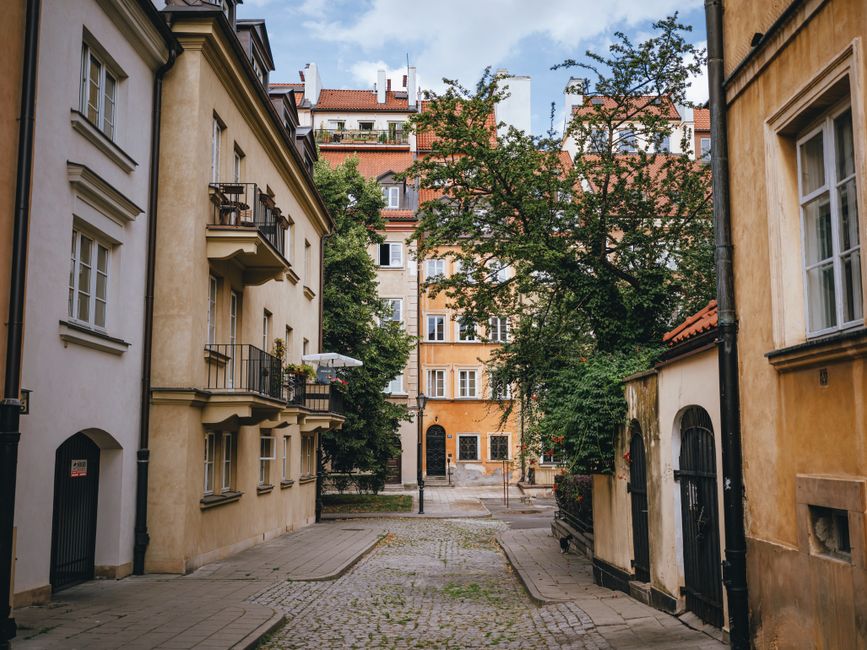 Charming hotel exterior in a historic Polish city, welcoming travelers