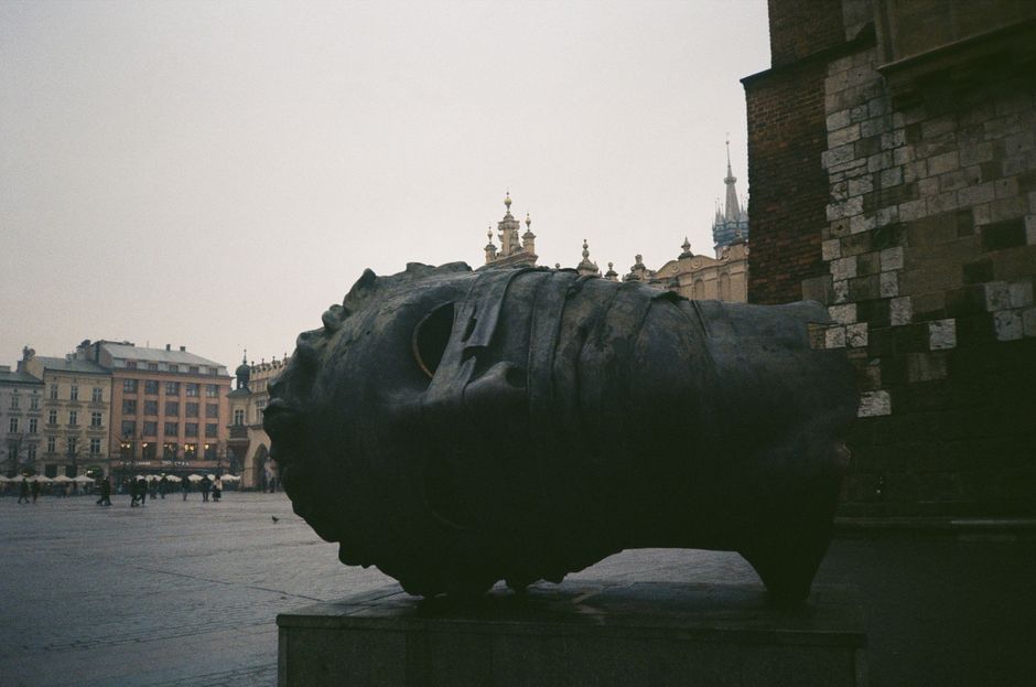 Historic Main Market Square in Krakow, Poland, bustling with tourists, a perfect starting point for day trips.