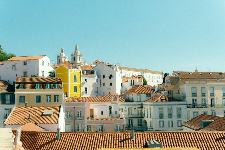 Panoramic view of Lisbon's historic district with iconic buildings and Tagus River, Portugal
