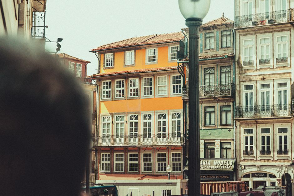 A vibrant street scene in Portugal, showcasing traditional architecture and local life, representing Portuguese culture.