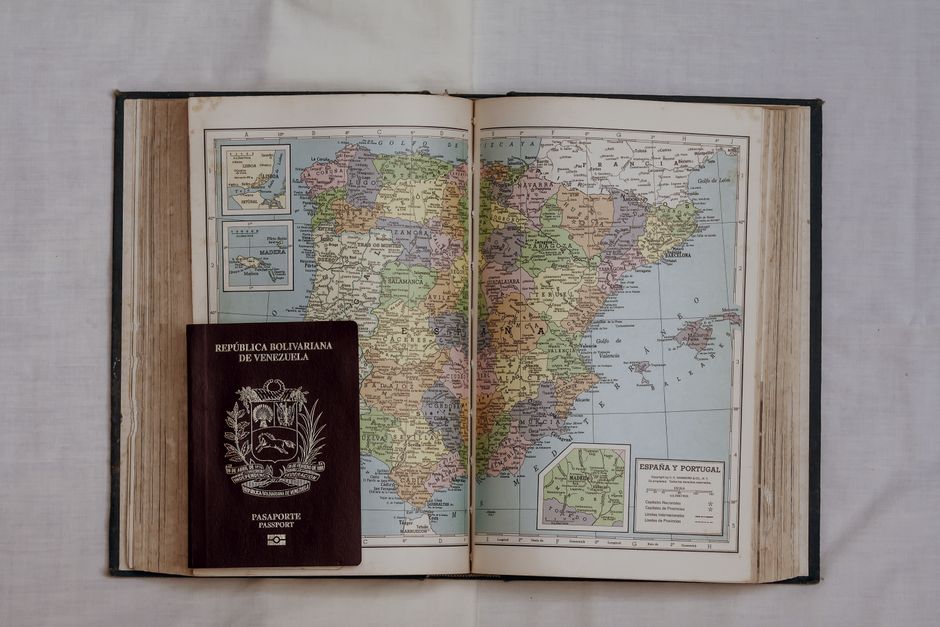 Traveler using a navigation app on a phone with a map of Portugal in the background