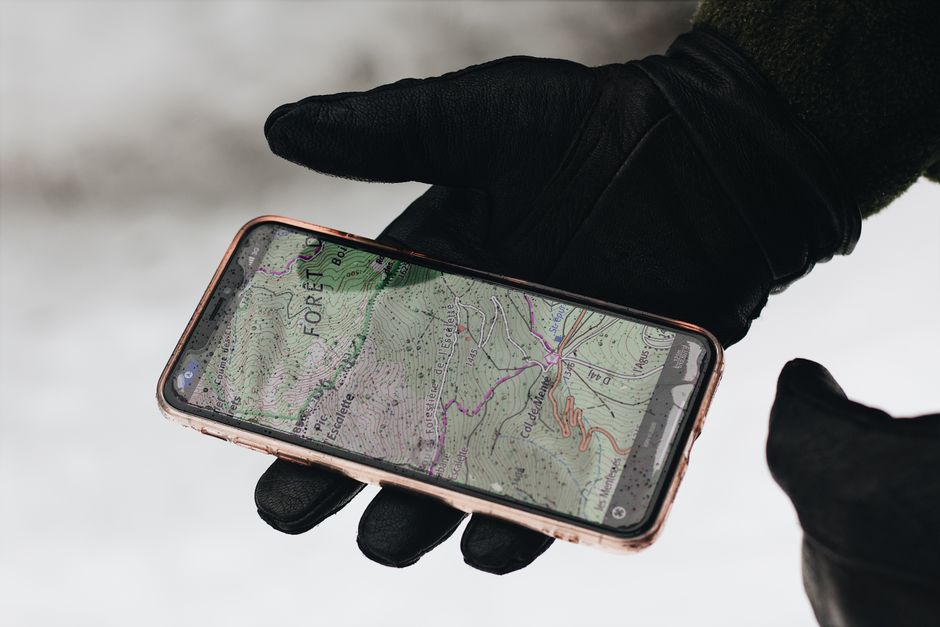 Traveler using a smartphone map to navigate in Romania