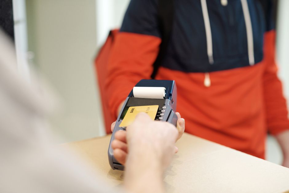 Traveler purchasing a prepaid SIM card at a mobile store in Romania