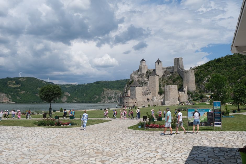 A group of tourists admiring Bran Castle in Transylvania, Romania, on a guided tour