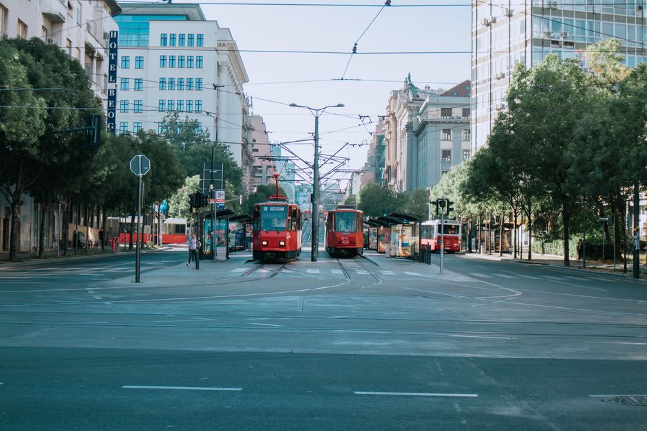 Modern tram in Bucharest, Romania, with city buildings in the background