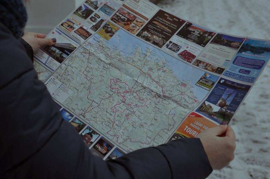 A traveler confidently exploring a scenic Romanian landscape, symbolizing peace of mind with travel insurance