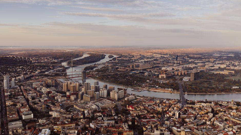 Beautiful sunset over Belgrade, Serbia, with the Sava and Danube rivers meeting, symbolizing a safe and memorable journey.