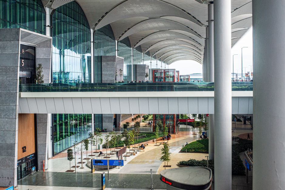 Travelers in a modern airport terminal in South Africa, representing flight compensation information