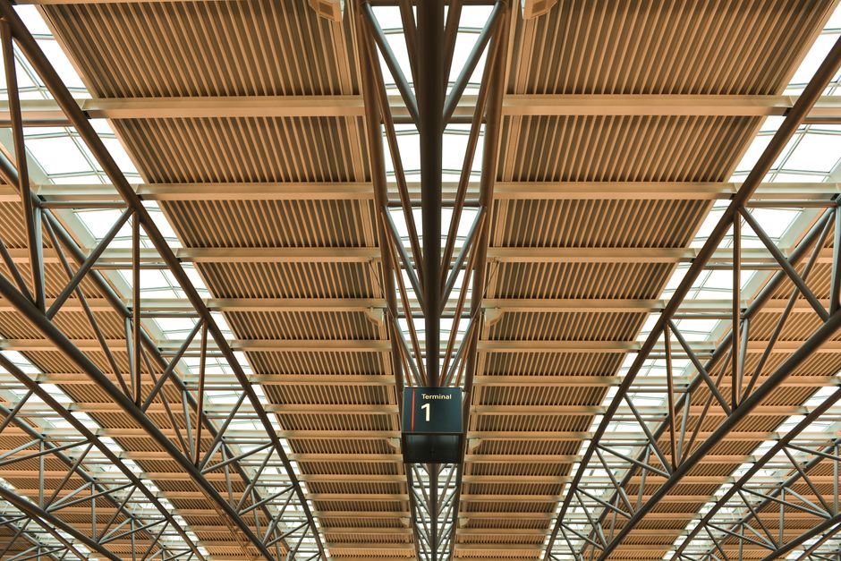 Modern departure lounge at Madrid-Barajas Adolfo Suárez Airport in Spain with passengers