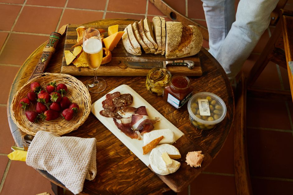 Vibrant spread of traditional Spanish tapas dishes on a wooden table in Spain