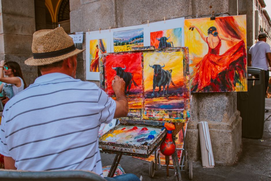 Traveler enjoying a vibrant street market in Spain, showcasing light summer clothing