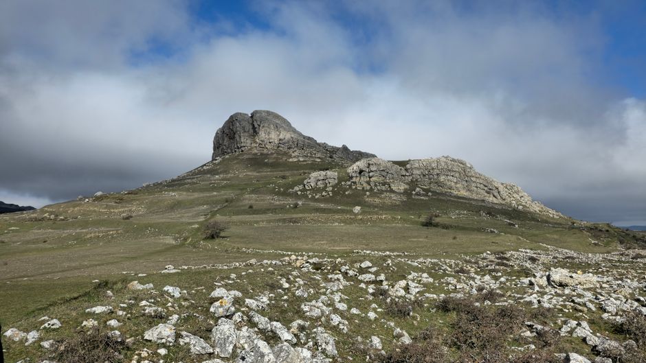 Diverse Spanish landscape showing sunny and cloudy weather, representing Spain's varied climate