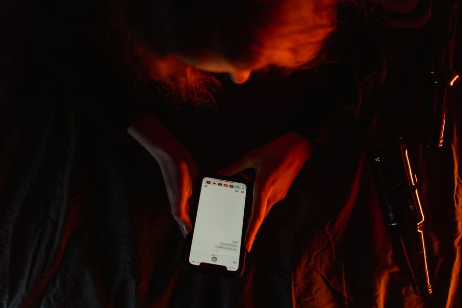 Traveler using a smartphone with a Swedish city background, symbolizing easy internet access in Sweden