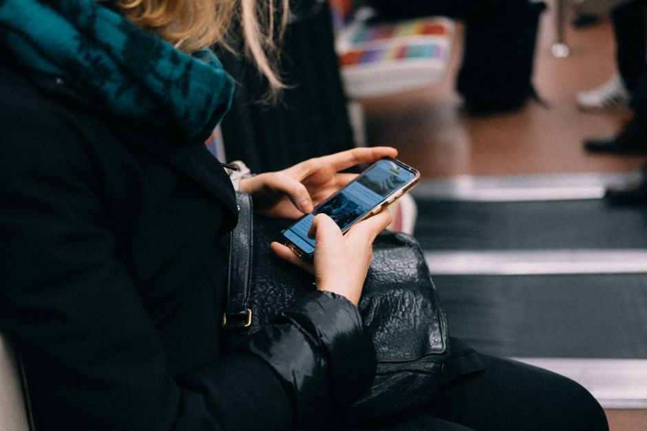 Tourist using a smartphone in Stockholm, Sweden, to stay connected
