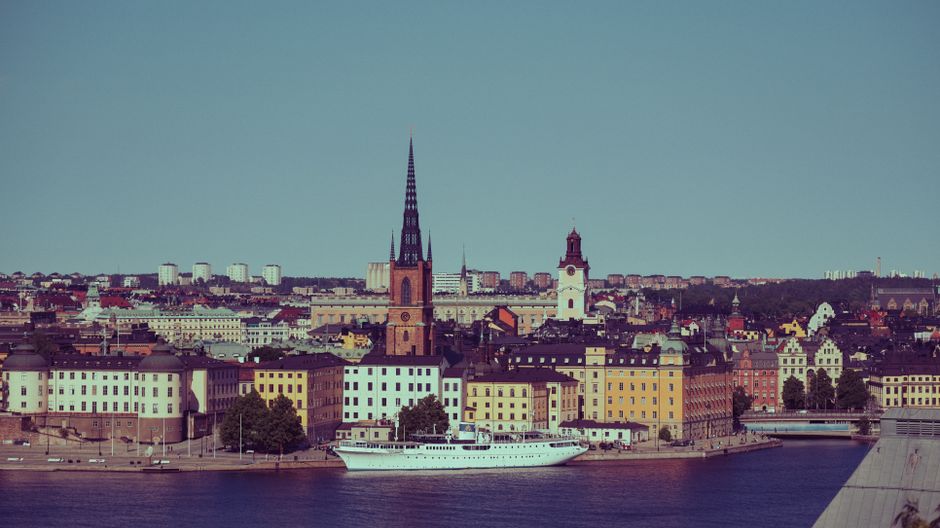 Sunny summer day in Stockholm, Sweden, with people enjoying outdoor cafes