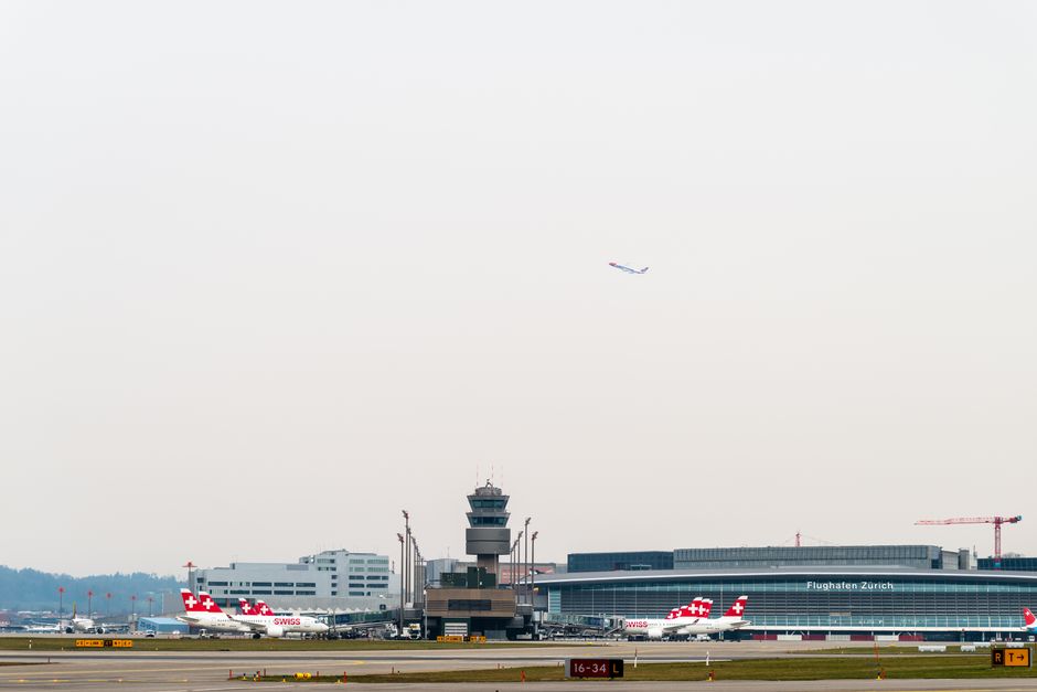 Modern terminal building at Zurich Airport, Switzerland, with planes visible