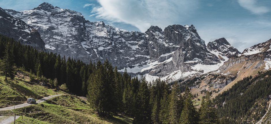Car driving on a scenic mountain road in the Swiss Alps