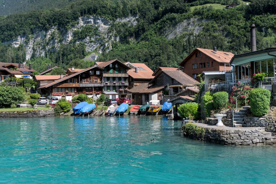 Traditional Swiss village with people in cultural attire during a festival in Switzerland