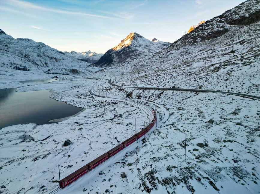 Panoramic view of a scenic train winding through the Swiss Alps, Switzerland