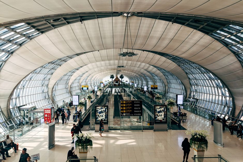 Tourist purchasing a local SIM card at Suvarnabhumi Airport in Thailand