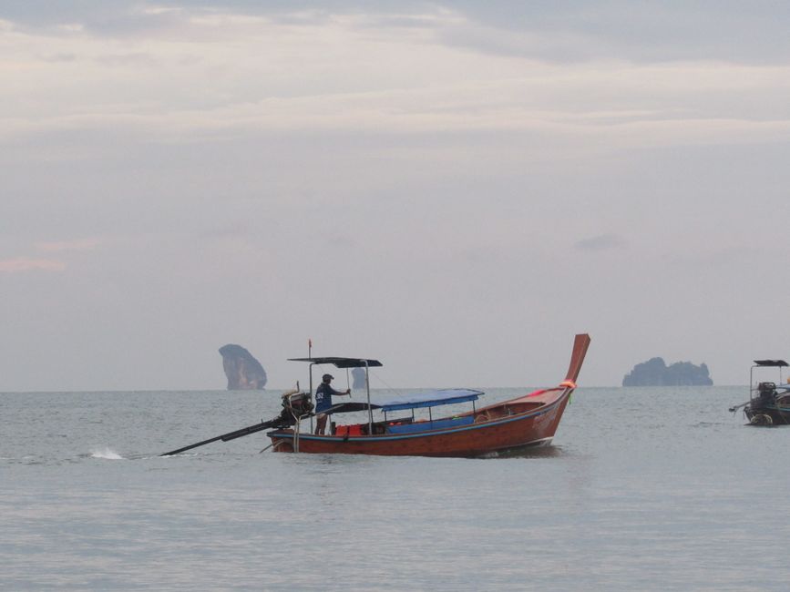 Longtail boats in turquoise waters near Phi Phi Islands, Thailand