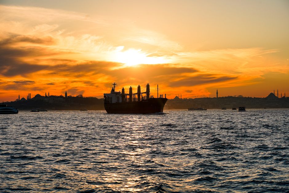 Sunset over the Bosphorus Strait in Istanbul, Turkey, with historic mosques and ferries
