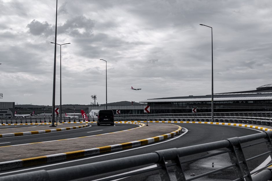Modern Istanbul Airport terminal with passengers and transport options in Turkey