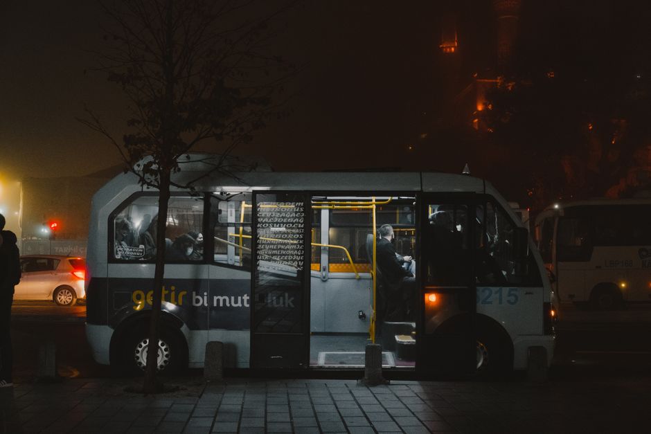 Vibrant public transport in Istanbul, Turkey, with a tram passing by a historic building